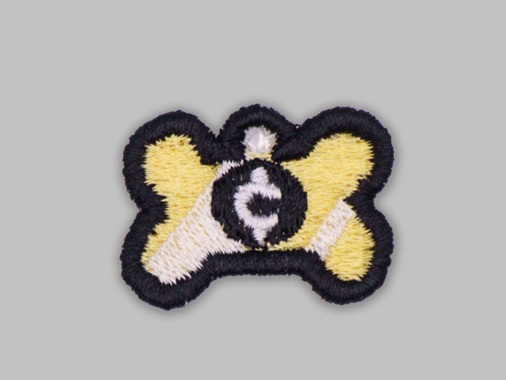 Embroidered patch with a design on a gray background